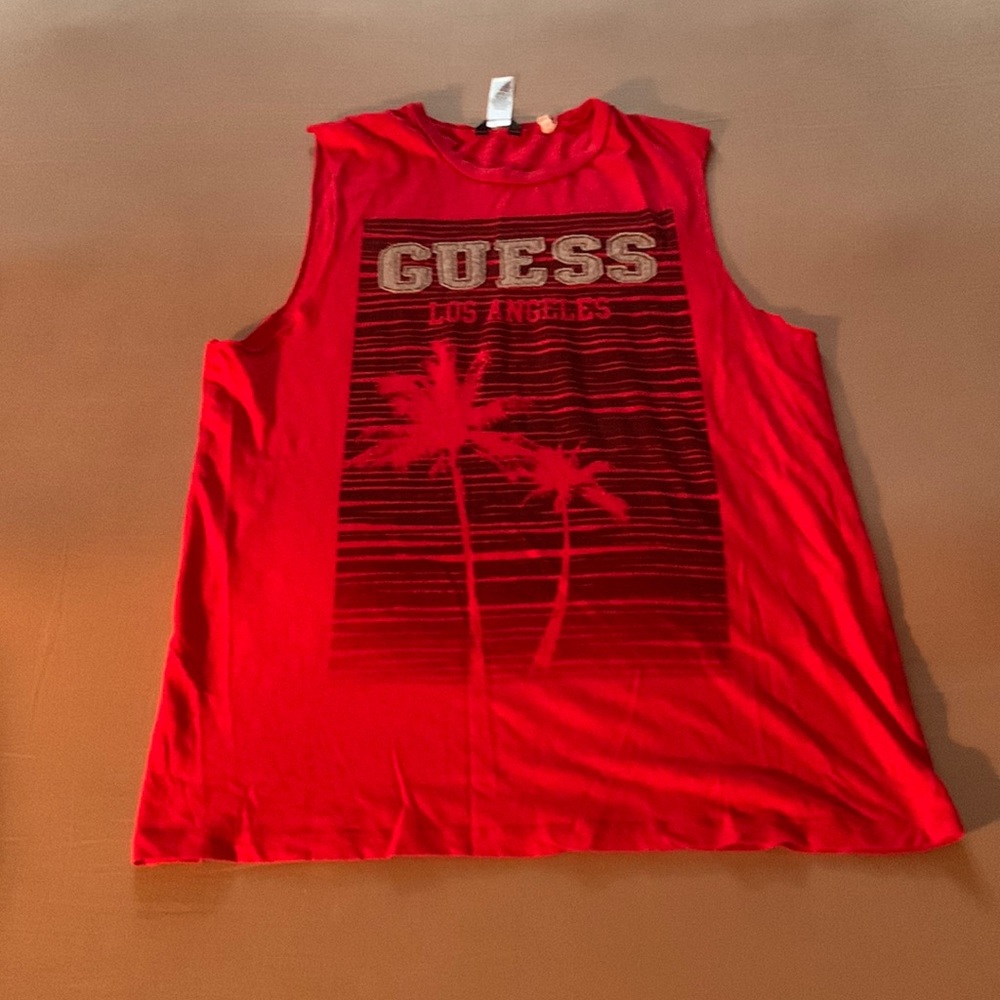 Selling a boys guess muscell shirt in very good condition any questions feel ask